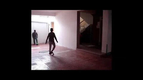 the soccer ball | played by hamid | with friends | in the garage | of the building
