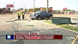 Pickup truck slams into bus stop, several people injured