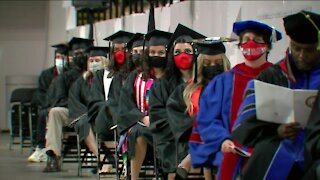 Two local universities celebrate graduates in different ways
