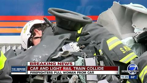 Woman rescued from light rail train crash
