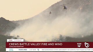 Crews battle Valley Fire and wind
