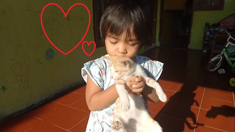 A Kid Shows Love of Her Best Cat Friend