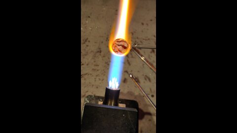 Molten glass marble in the making