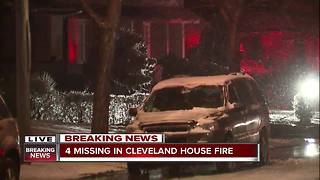 2 adults and two children unaccounted for after a fire rips through a house in Cleveland