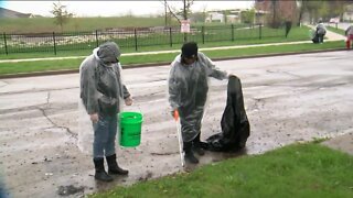 Community braves the rain to clean up the streets of Milwaukee