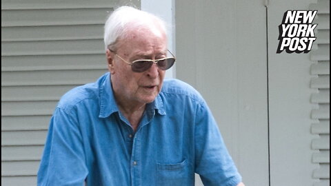 Michael Caine, 90, looks refreshed at the beach after spinal surgery