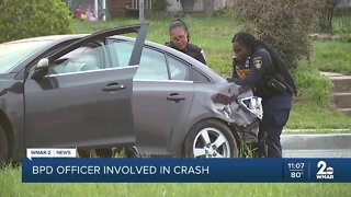 Baltimore City Police officer involved in crash, strikes pole, car catches fire
