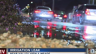 Water spills onto the road near Valley View, Meade