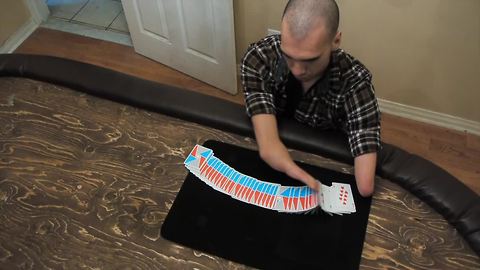 Handless magician demonstrates inspiring card tricks