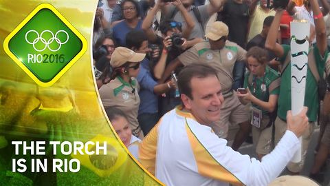The Olympic torch lands in Rio amid protests
