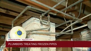 Plumbers Treating Frozen Pipes