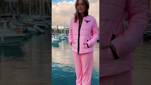 Czarina Sasha in a Pink Puffer jacket on a pier in Nice, France for Czar Clothing