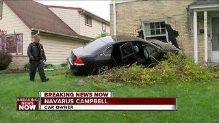 Driver of stolen car crashes into home
