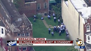 Six police officers shot in standoff