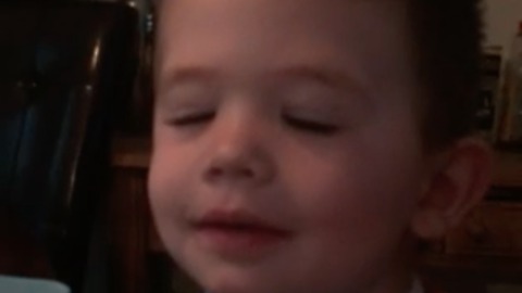 Cute footage of toddler boy trying to wink one eye in the morning