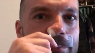 Man uses wax to remove nose hairs