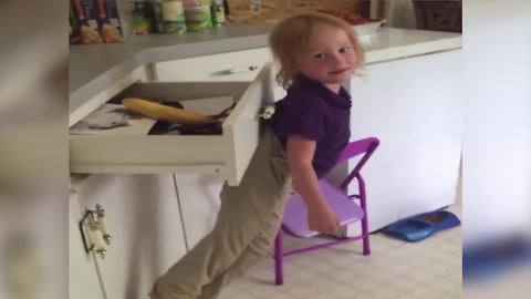 Tot Boy Gets Stuck On A Drawer Handle