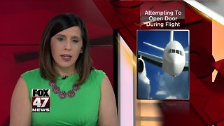 Woman attempts to open boarding door on Delta flight shortly after takeoff