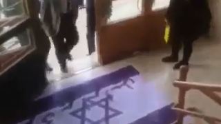 Iranian Professor Refuses to Step on Israeli or American Flags