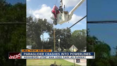 Paraglider crashes into power lines causing electric burns, power outage