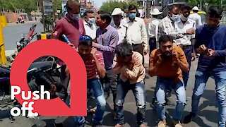 Indian police punish people ignoring coronavirus curfew with squats