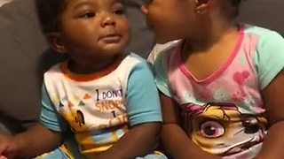 Baby siblings preciously show affection toward one another