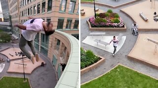 Parkour daredevil performs extreme jump from high building