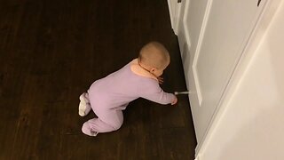 Baby is Mesmerized by Door Stop