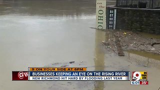 Businesses keeping an eye on rising river