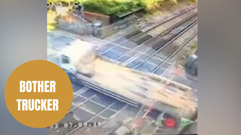 Lorry driver hunted by police for smashing through barriers of level crossing