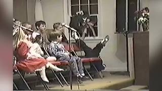 Little Boy Goofs Off On The Stage At Church Choir Program