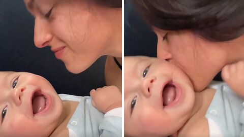 Adorable Baby Giggles Sweetly While Mom Kisses Him