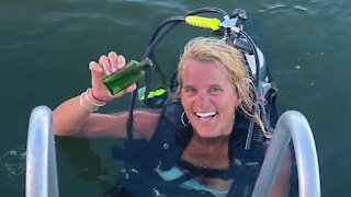 Michigan diver finds nearly 100-year-old message in a bottle, connects with writer's family