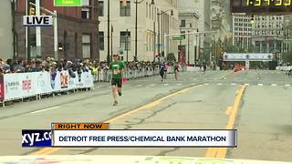Runners cross the finish line at the Detroit Free Press/Chemical Bank Marathon
