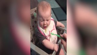 Baby Girl Tastes An Applesauce For The First Time