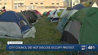 Protesters remain outside City Hall for seventh day
