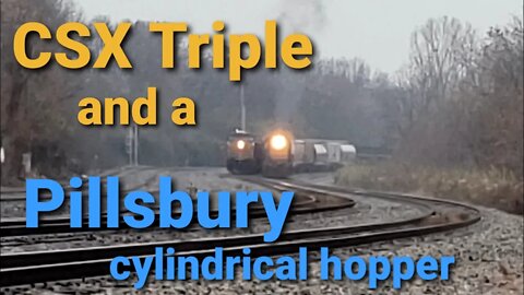 CSX triple with a pillsbury cylindrical hopper, and a rock