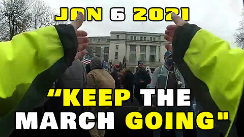 Police officer encouraging protesters to "Keep the march going"