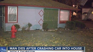 Man dies after crashing car into house