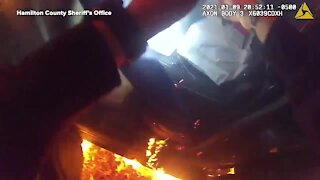 Unconscious woman saved from burning car