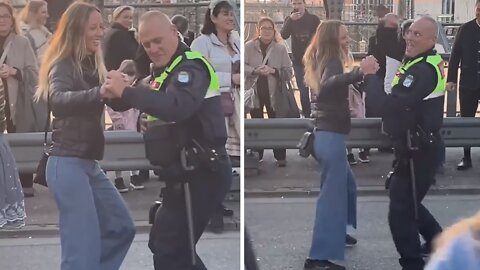 Police Officer Invites Woman To Dance During Oktoberfest