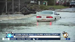 Driver becomes stranded on flooded street near Fashion Valley mall