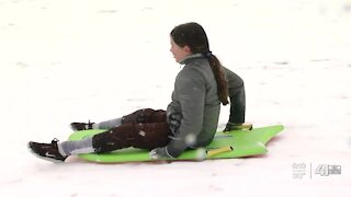 Families have fun in the snow at Westwood Park