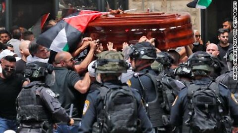Israeli police beat mourners with batons at funeral procession for veteran journalist