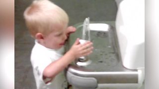 Tot Boy Can't Figure Out How A Drinking Fountain Works
