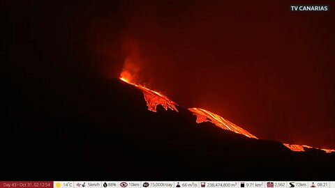 Day A Lava flow emerges from the haze la palma volcano volcanic eruption in the canary islands video