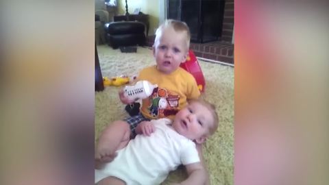 "Toddler Boy Kisses Baby Brother and Baby Spits on Him"