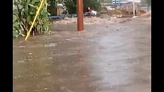 VIDEO: Man pulls 2 people from car in flooded road