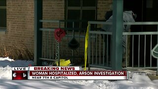 Woman hospitalized, arson investigation