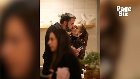 Glum Ben Affleck texts while kissing Jennifer Lopez on Christmas shopping trip with their moms